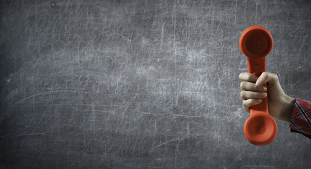 Close of woman holdingn in hand old phoneの写真素材