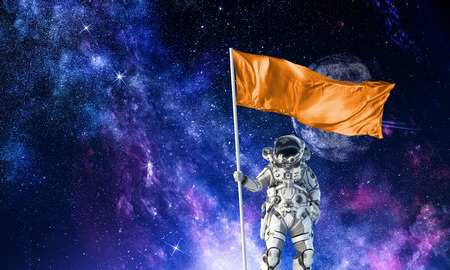 Astronaut man with flag in hand. Mixed media