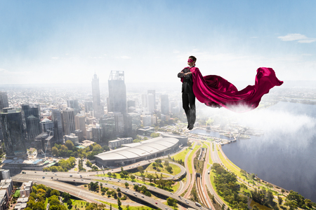 Super man in skyの写真素材