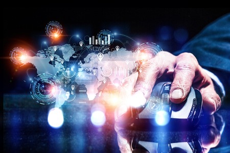 Close up view businessman hand using computer mouse and media interfaceの写真素材