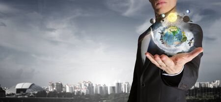 Human hand holding planet earth in palm.の写真素材