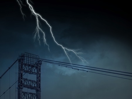High voltage lines tower and lightning striking itの写真素材