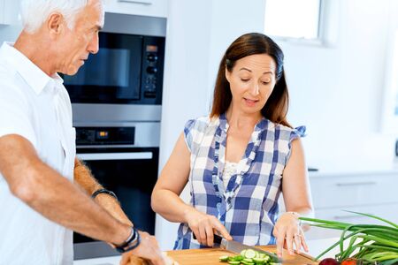 Married couple cooking at homeの写真素材
