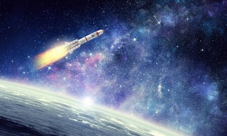 Rocket flying in starry space sky. Mixed media