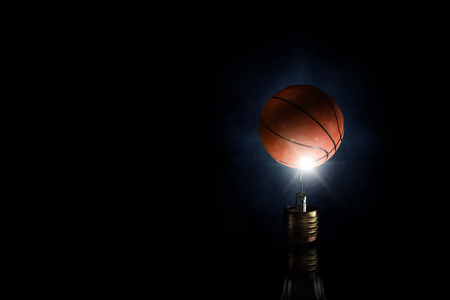 Light bulb and basket ball as sign for creativityの写真素材