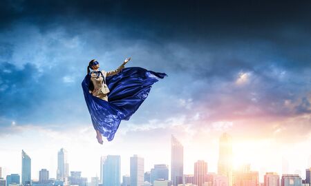 Super woman in skyの写真素材