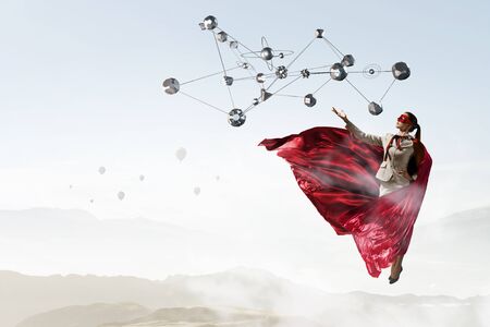 Super woman in skyの写真素材