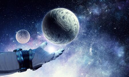 Astronaut hand and Earth in space.