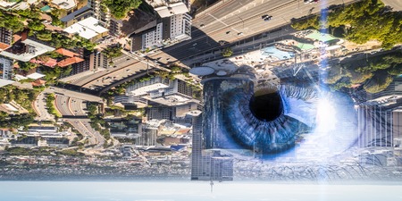 Bird eye view of modern city with human female eyeの写真素材