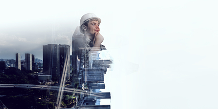 Builder man against cityscapeの写真素材