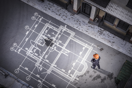 Man engineer thinking over his plan. Mixed mediaの写真素材