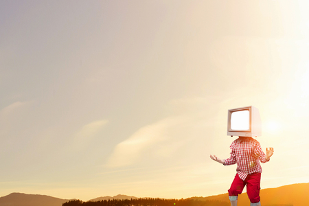 Kid boy with TV monitor for his head. Mixed mediaの写真素材