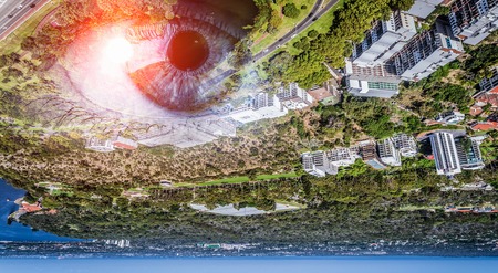 Bird eye view of modern city with human female eyeの写真素材