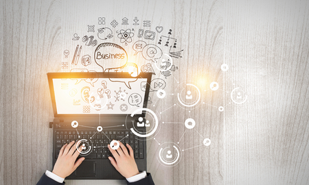 Top view of businesswoman typing on laptop keyboard. 3d renderingの写真素材