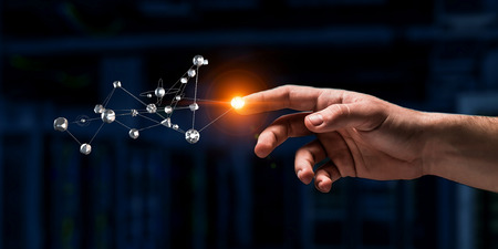 Close of man touching with finger metal connection concept. Mixed mediaの写真素材