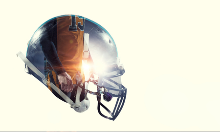 Double exposure of rugby helmet and players on white backgroundの写真素材