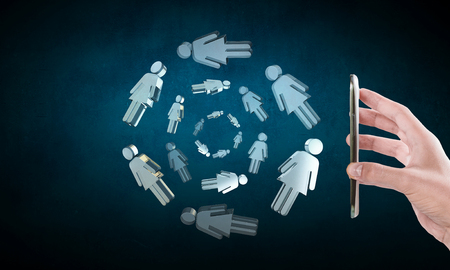 Hand of man holdinng smartphone presenting social connection concept. 3d renderingの写真素材