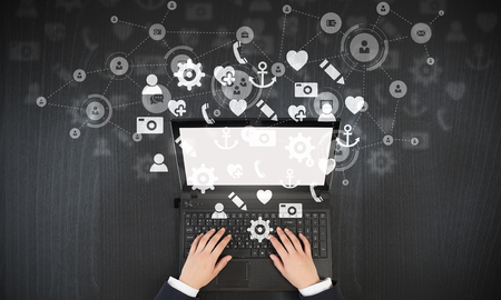 Top view of businesswoman typing on laptop keyboardの写真素材