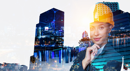 Attractive architect woman and her project. Mixed mediaの写真素材