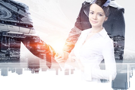 Attractive business lady working on tablet . Mixed mediaの写真素材