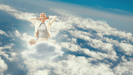 Woman float above cityの写真素材