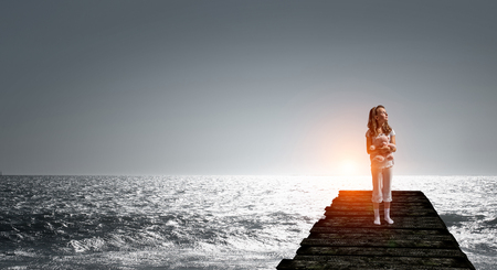 Feeling lost and lonely. Mixed mediaの写真素材