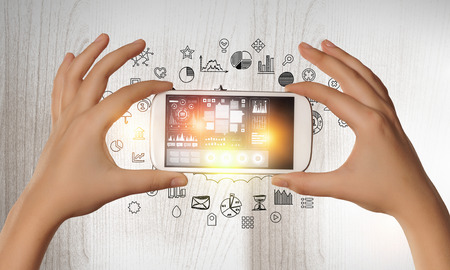 Devices connecting people . Mixed mediaの写真素材