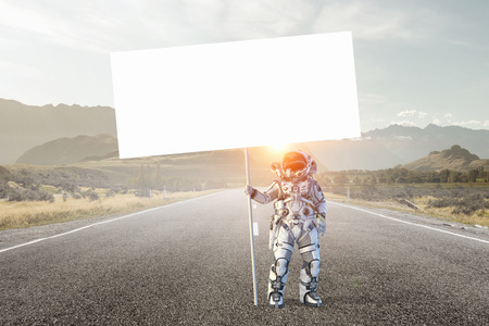 Spaceman with banner. Mixed mediaの写真素材