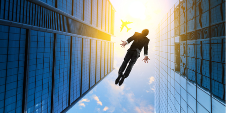 Businessman committing suicide due to crisisの写真素材