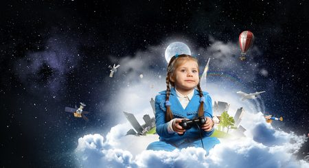 Girl playing video game. Mixed mediaの写真素材
