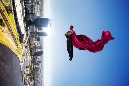 Super man in skyの写真素材
