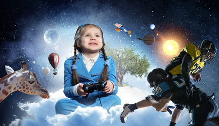 Girl playing video game. Mixed mediaの写真素材