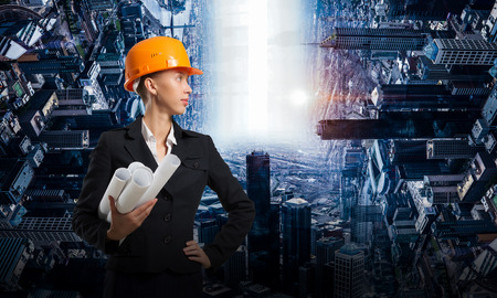 Attractive architect woman and her project. Mixed mediaの写真素材