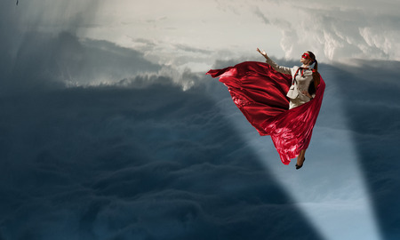 Super woman in sky. Mixed mediaの写真素材