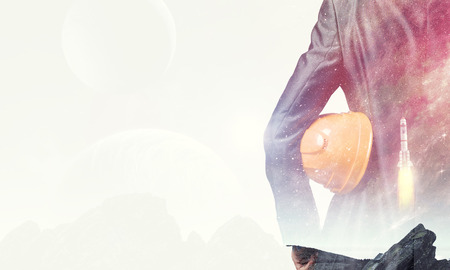 Back view of businessman on fantasy space background. Mixed mediaの写真素材