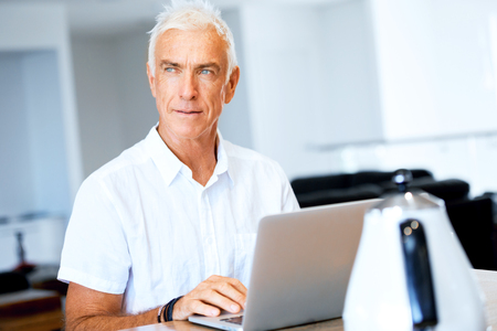 Man working on laptop at homeの写真素材