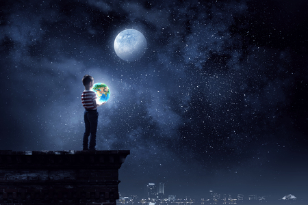 Whole world in hands . Mixed mediaの写真素材