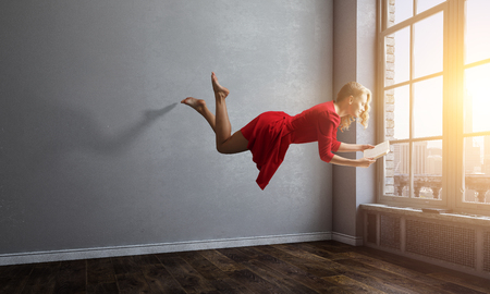 When reading takes your away. Mixed mediaの写真素材