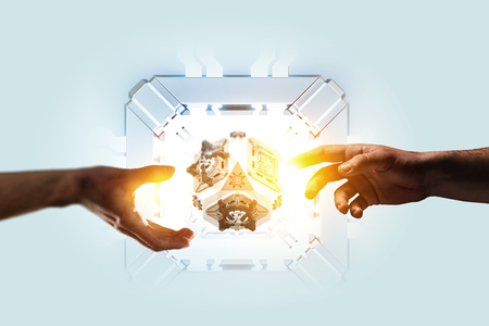 Human hands and technology managing concept. Mixed mediaの写真素材