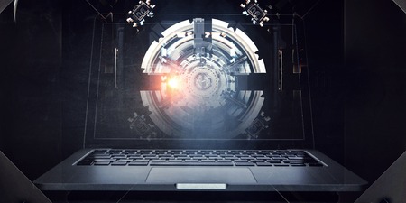 Laptop on mechanic tech backgroundの写真素材