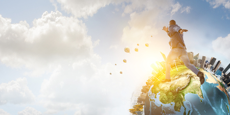 Joyful black man wearing casual clothes walking around. Mixed mediaの写真素材