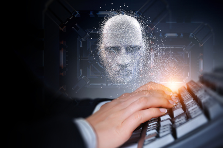 Hands of a young woman on computer keyboard with a digital head on the backgroundの写真素材