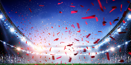 Football stadium background with flying confettiの写真素材
