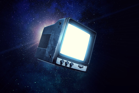 Vintage TV set levitating in space