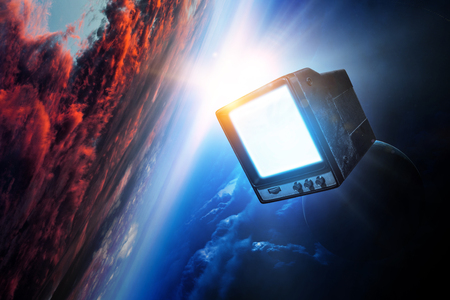 Vintage TV set levitating in spaceの写真素材