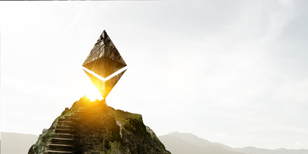 Ethereum symbol made of stone on a ladderの写真素材