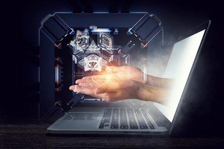 Human hands and technology managing concept. Mixed mediaの写真素材