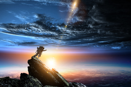 Spaceman and planet, human in space conceptの写真素材