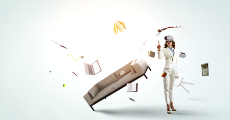 Young female in virtual reality. Mixed mediaの写真素材