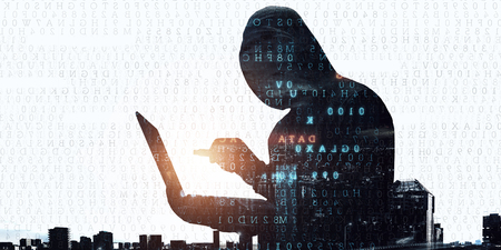 Hacker in hoodie dark themeの写真素材